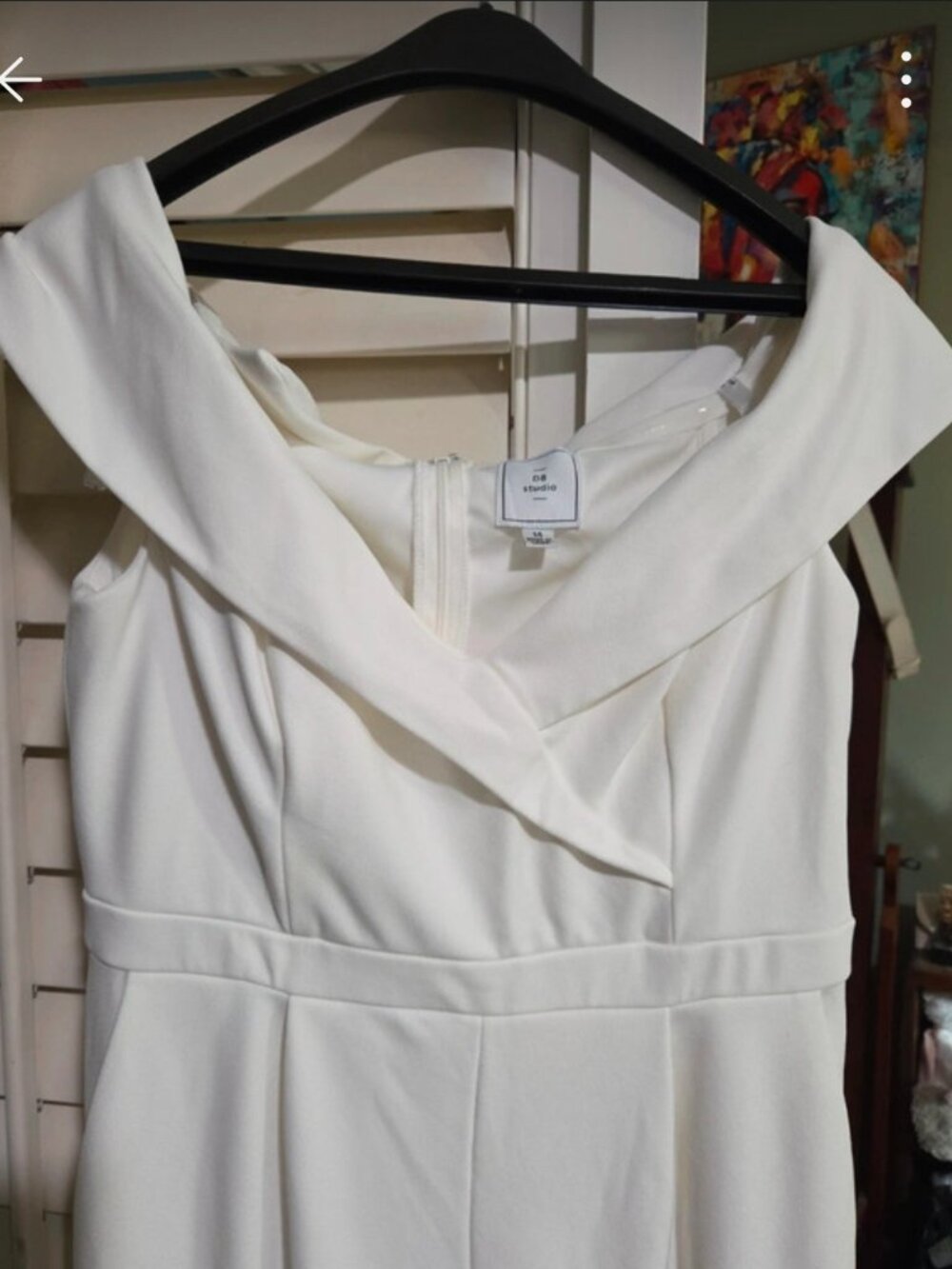 White jumpsuit with off the shoulder detail
